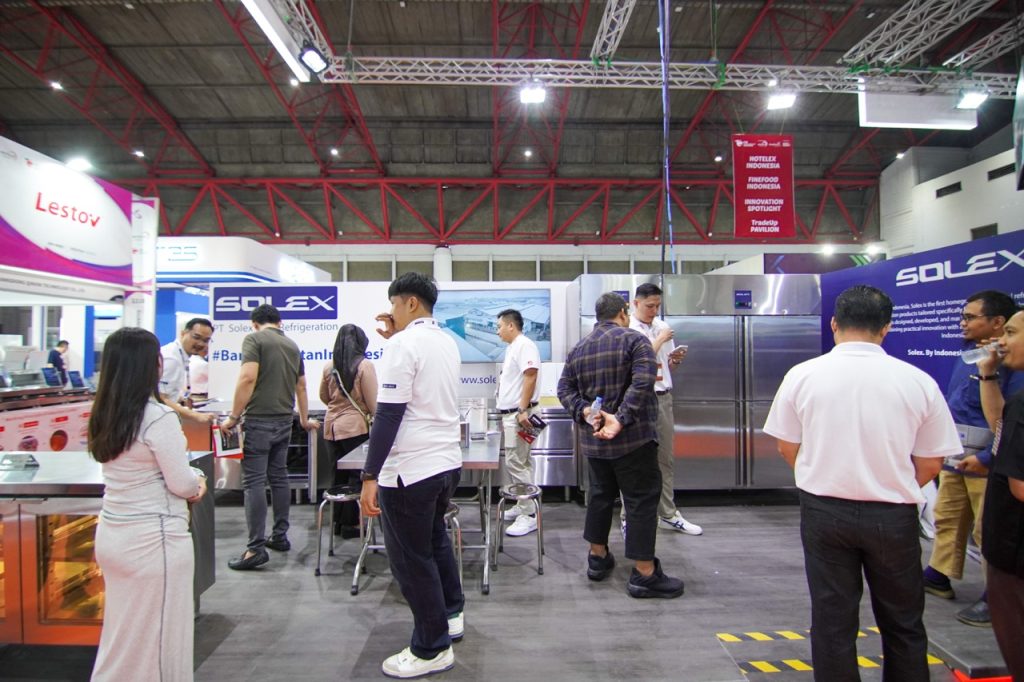 Visitor engagement at the bustling Solex booth during the FHI 2025 exhibition, showing industry professionals interacting with Solex's commercial refrigeration units.